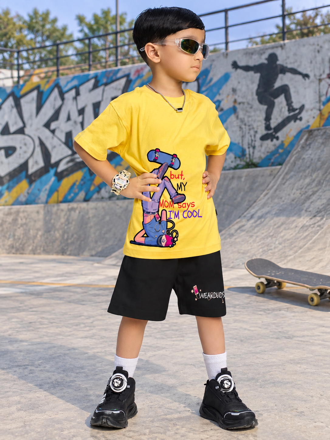 COOL DUDE SKATER CO-ORD FOR BOYS GIRLS BLACK YELLOW BLACK worn by a boy in a skater park with black and yellow attire.
