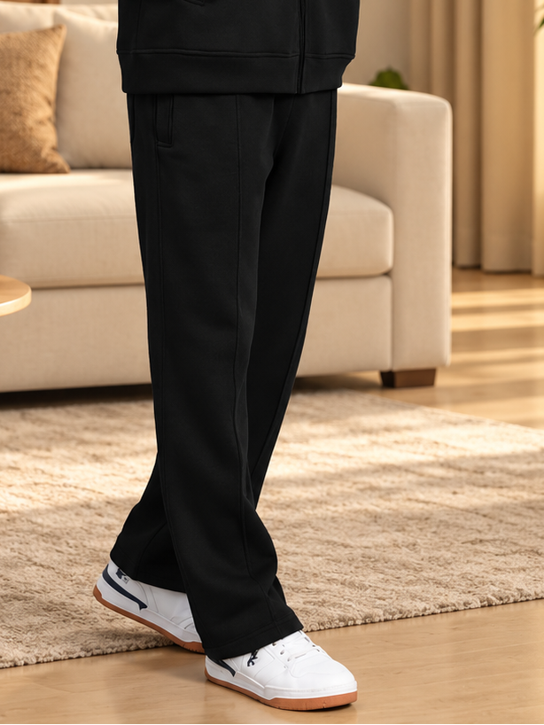 SHAGGY COTTON FLEECE JOGGER BLACK worn with white sneakers in cozy living room setting