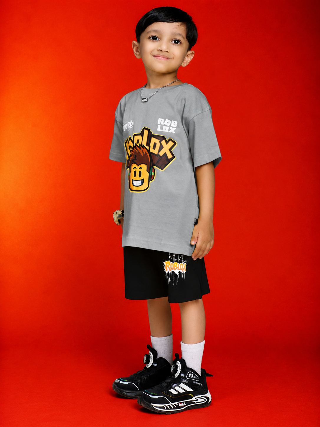 ROBLOX WORLD FIT CO-SET FOR BOYS GIRLS GREY BLACK worn by a boy, featuring a grey shirt and black shorts.