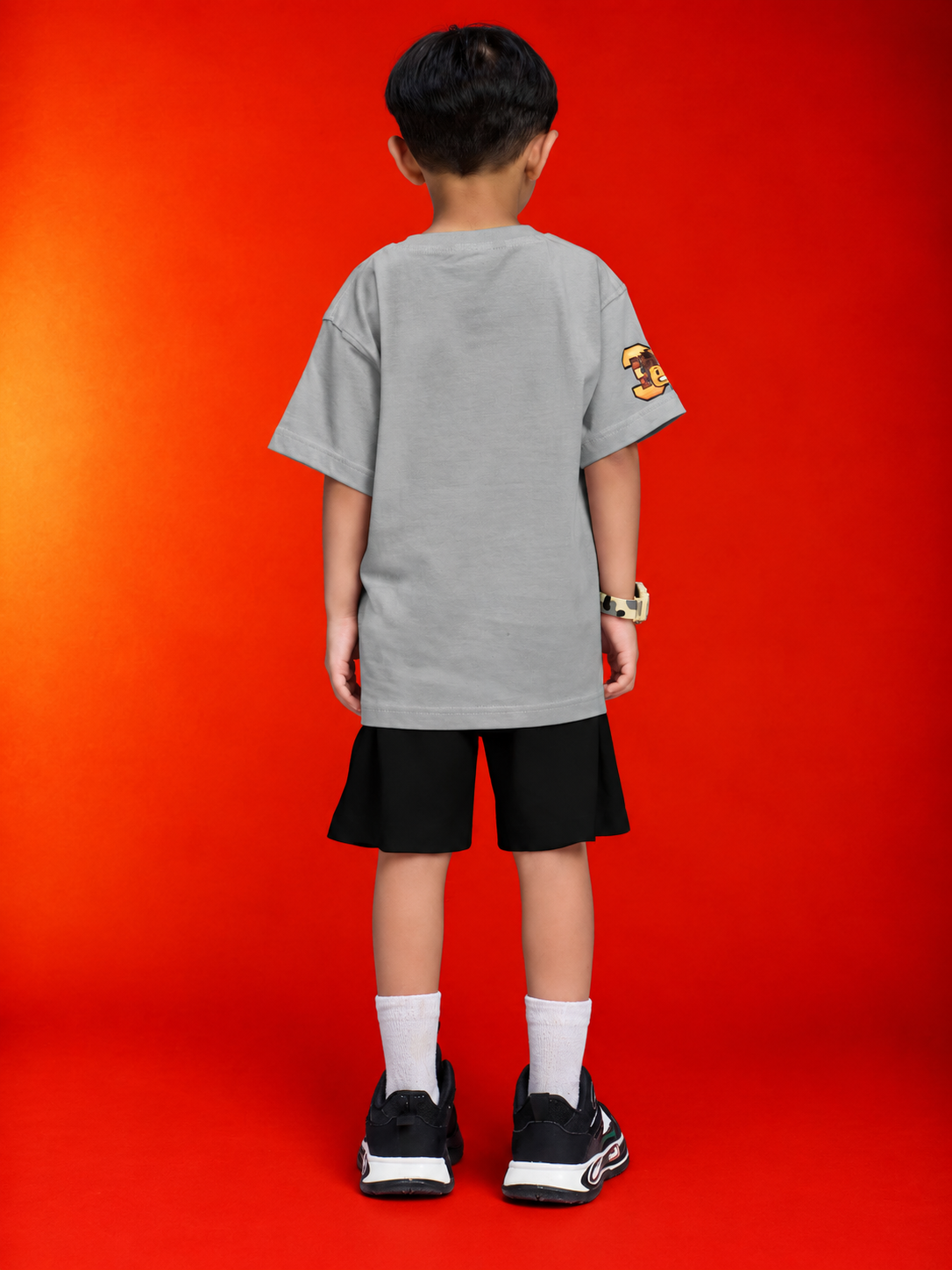 ROBLOX WORLD FIT CO-SET FOR BOYS GIRLS GREY BLACK worn by a child from the back against a colorful background.