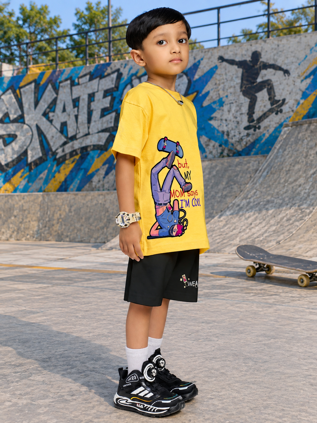 COOL DUDE SKATER CO-ORD FOR BOYS GIRLS BLACK YELLOW BLACK worn by a boy in a skate park setting, showcasing urban style.