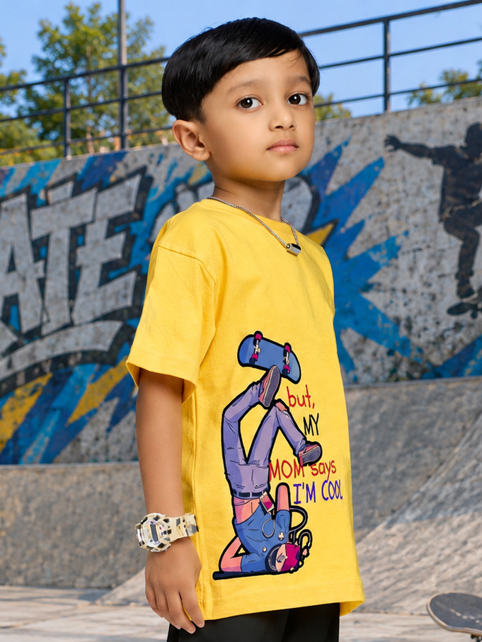 COOL DUDE SKATER T-SHIRT FOR BOYS GIRLS YELLOW worn by a kid at a skate park, showcasing vibrant design and streetwear vibe.