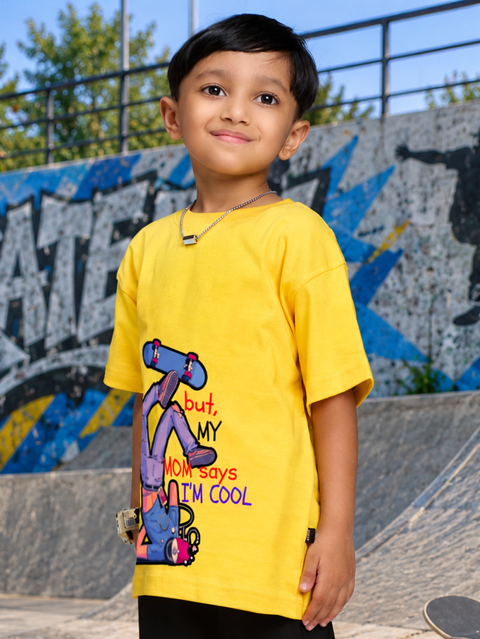 COOL DUDE SKATER T-SHIRT FOR BOYS GIRLS YELLOW worn by a boy at a skate park, showcasing its vibrant design and fun vibe.