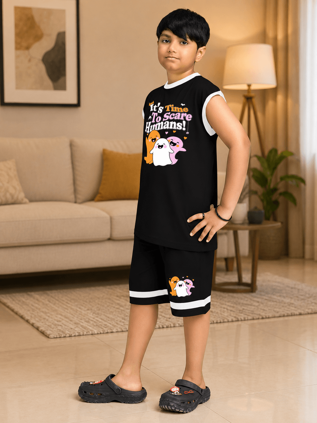 HALLOWEEN GRAPHIC PRINT CO-ORD FOR BOYS GIRLS BLACK worn by a child, featuring playful graphic print in a stylish black outfit.