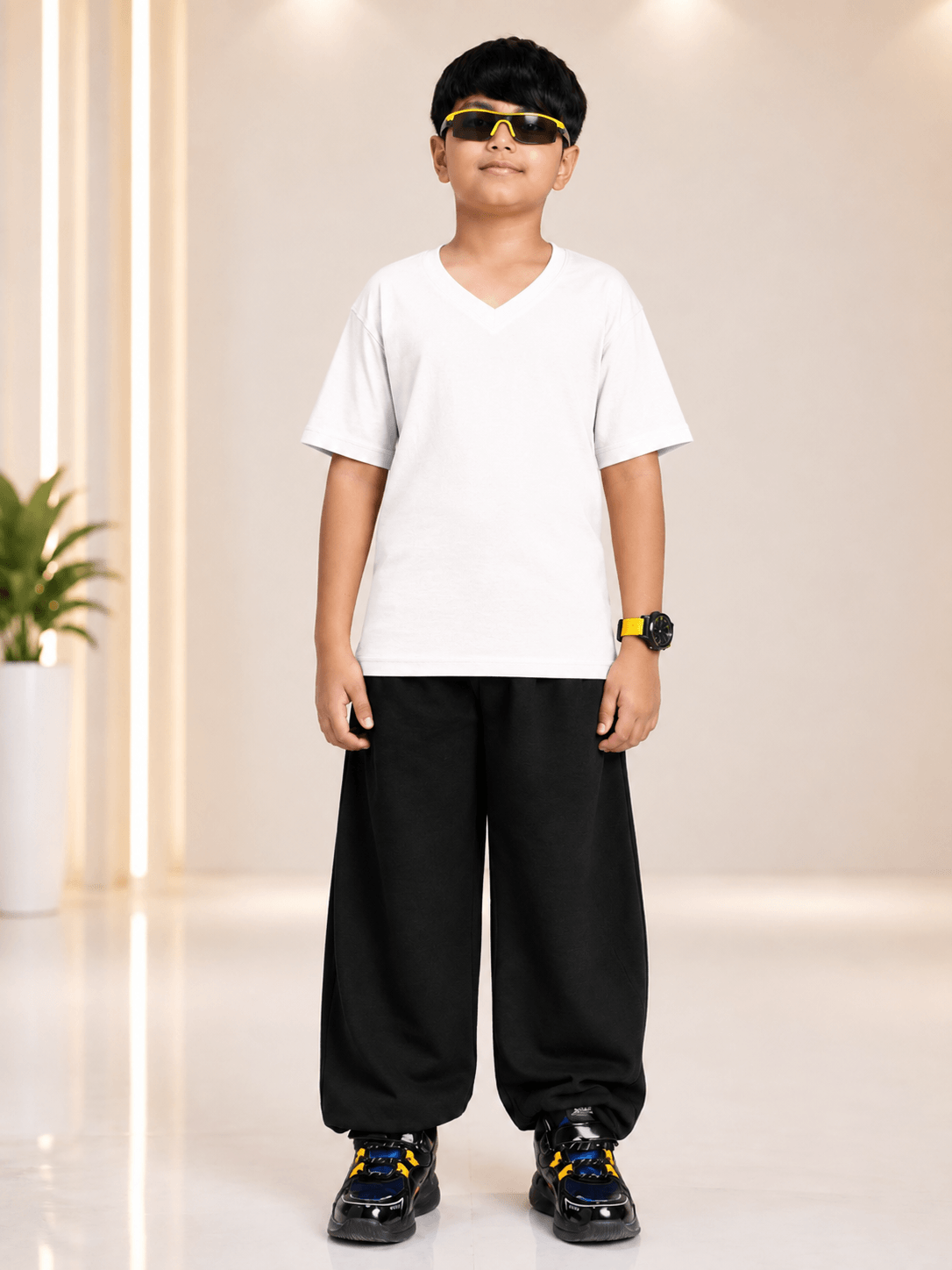 COOLFIT JOGGER FOR BOYS GIRLS BLACK styled with a white t-shirt and sporty sneakers, perfect for casual outings.