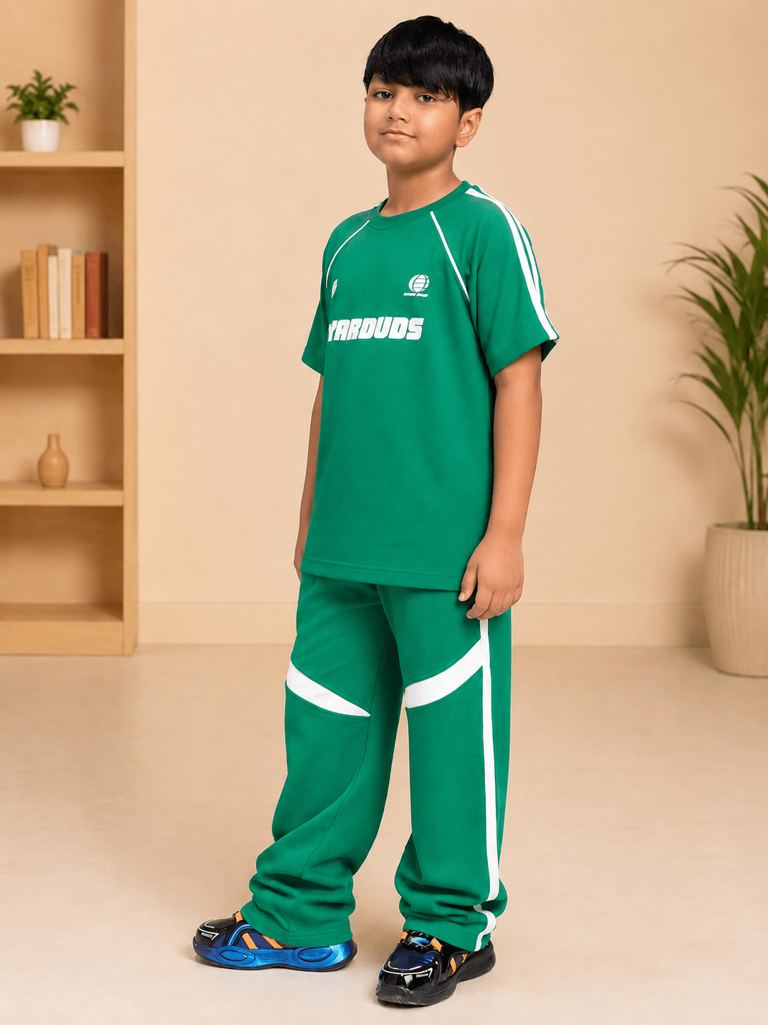 KIDS ROSTER CO-ORD BOYS GIRLS GREEN WHITE model wearing green and white coordinated kids' outfit.