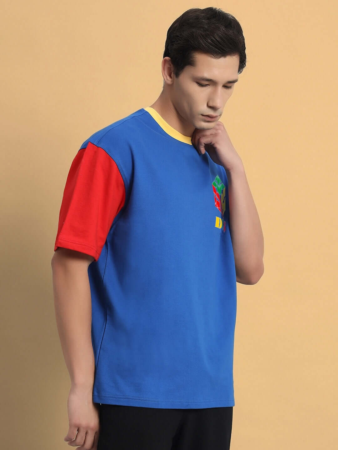 Finley Color Blocked Oversized T-Shirt with red, blue, and yellow design, made from premium cotton French terry, worn by a model.