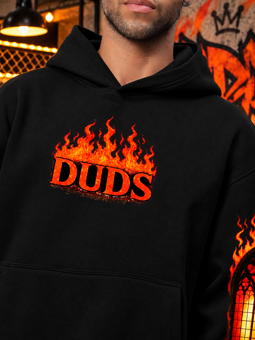 FIRE NEVER KILLS THE LIGHT FLEECE CO-ORD BLACK hoodie with flame graphic worn by model, streetwear style