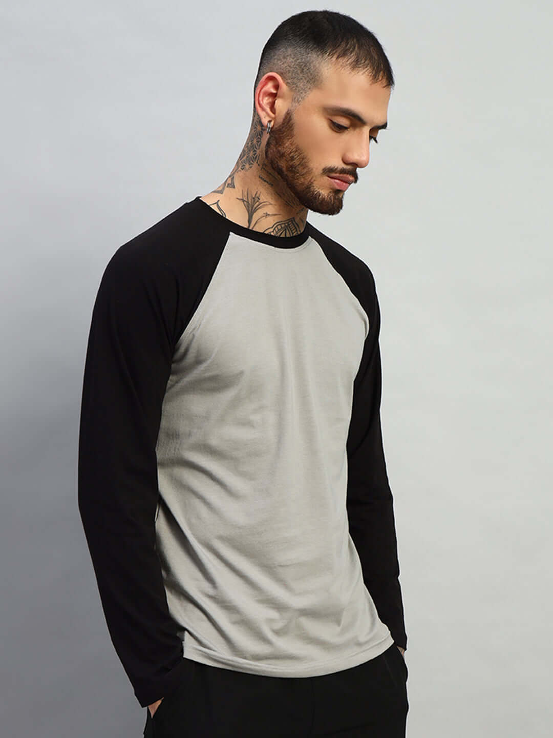 Fitflow slim fit sweatshirt in black and grey, premium heavy gauge 100% cotton fabric, worn by model, showcasing modern casual style.