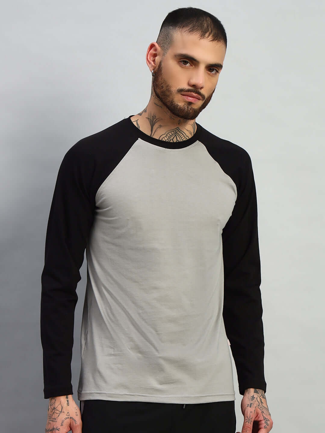Man wearing FITFLOW Slim Fit Sweatshirt in black-grey, made from premium 100% cotton fabric. Ideal for style and comfort. Origin: India.