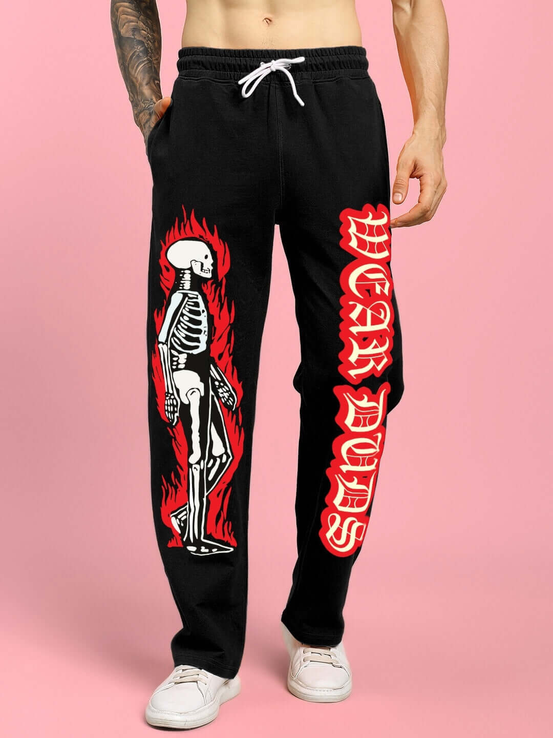 Black jogger featuring flaming skeleton design and 'WEAR DUDS' text, showcasing a relaxed fit by DUDS.