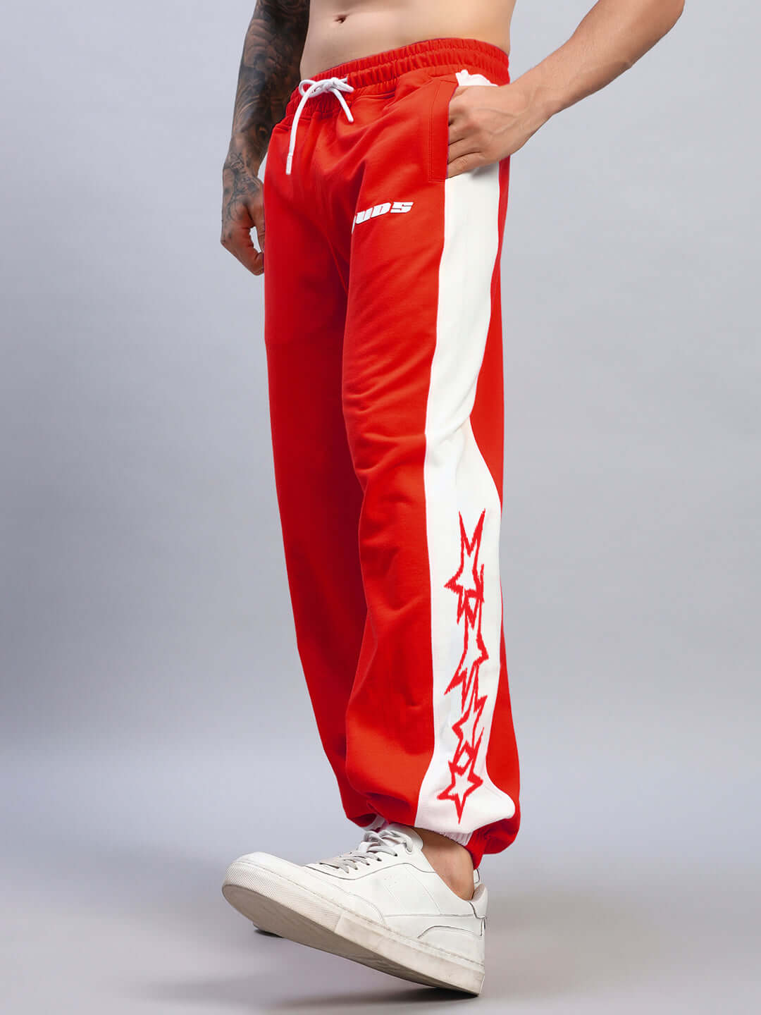 Alt Tag: Red and white relaxed fit joggers with sporty stripes, perfect for casual wear. Comfortable and customizable sizing available.