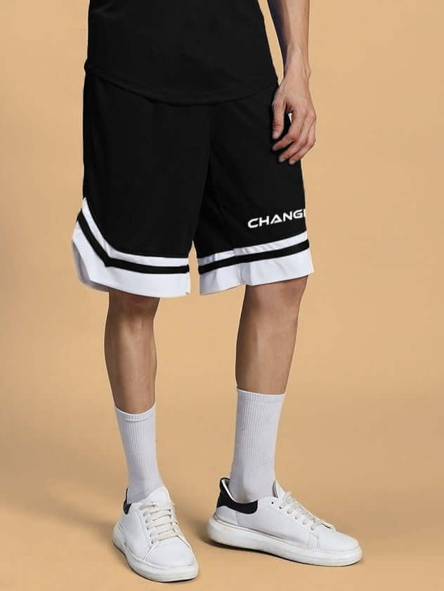 FLEX REGULAR FIT COTTON SHORTS BLACK worn with white sneakers showcasing custom fit option.