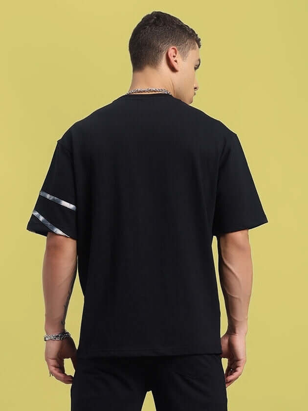 Back view of Flicker Designer Oversized Black T-shirt featuring premium cotton blend fabric with stylish sleeve detailing.