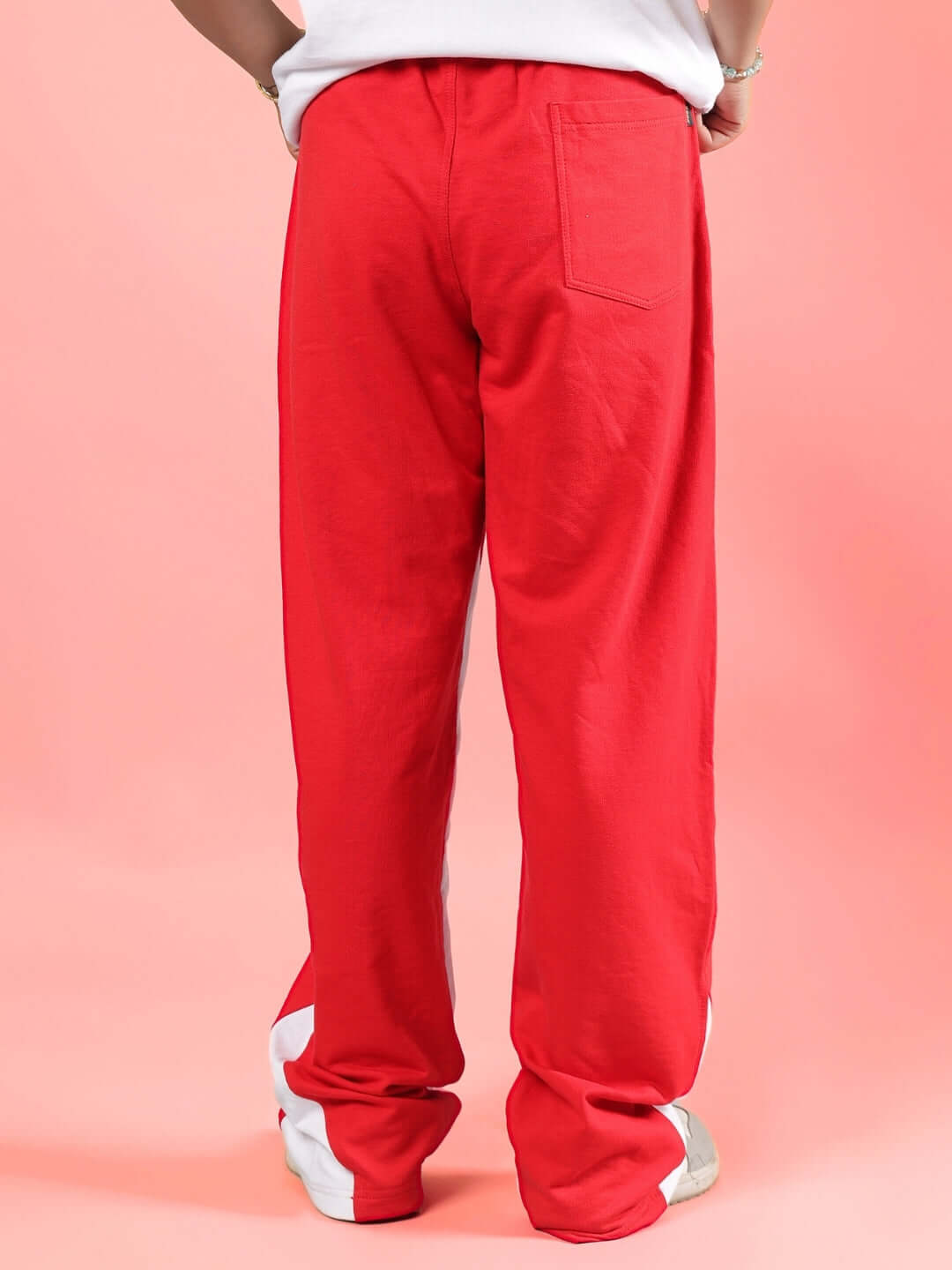 Red unisex floppy jogger pants for boys and girls, made to order with custom fit option, crafted by experienced tailors at DUDS.