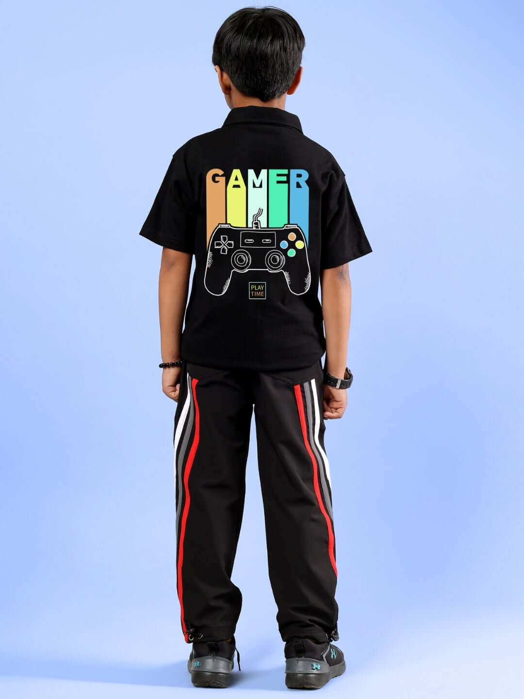 Boy wearing FOREVER GAMER black co-ord with colorful gamer-themed back design, showcasing DUDS brand.