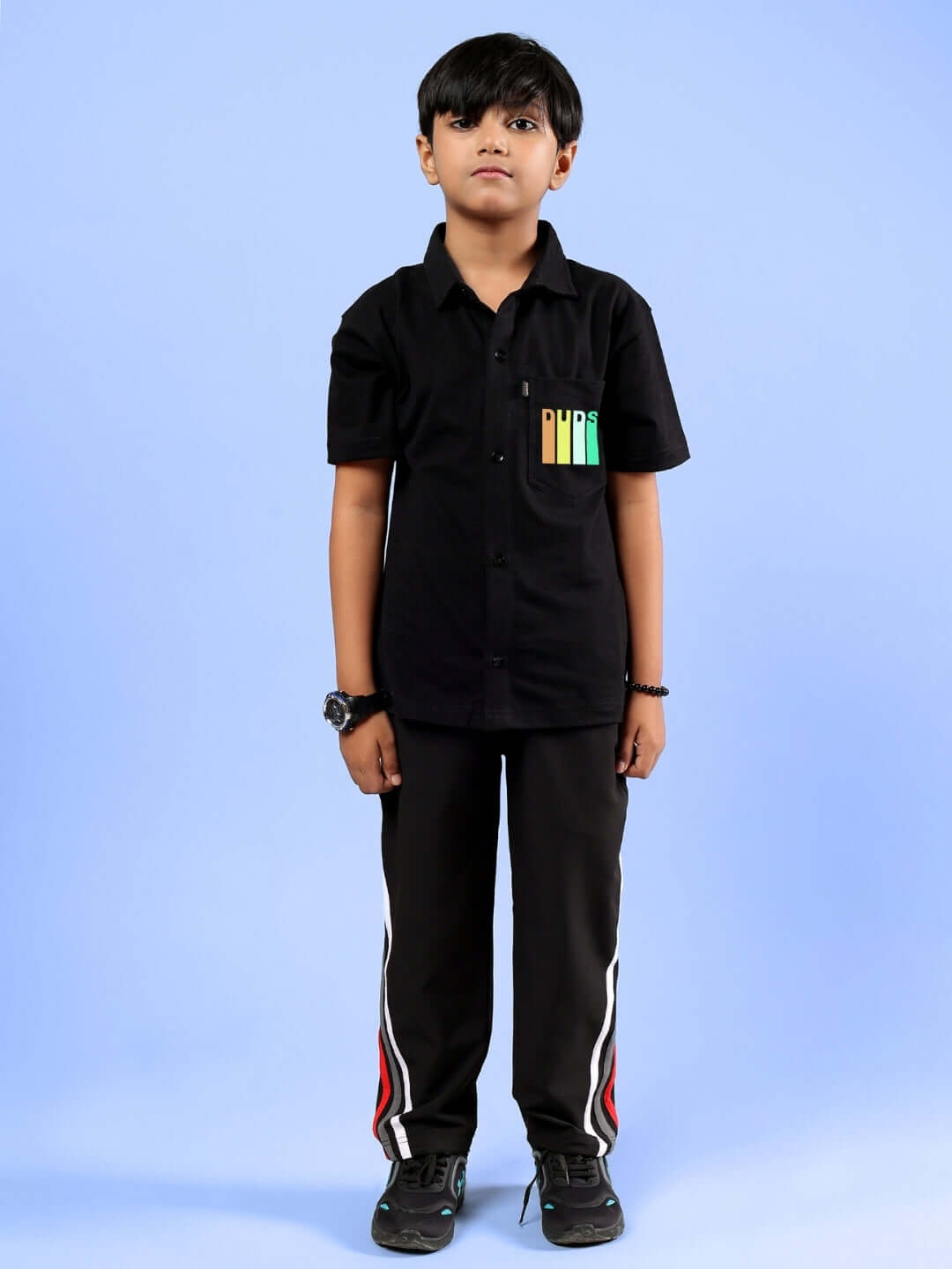 Child wearing FOREVER GAMER CO-ORD FOR BOYS & GIRLS BLACK outfit with colorful pocket design.