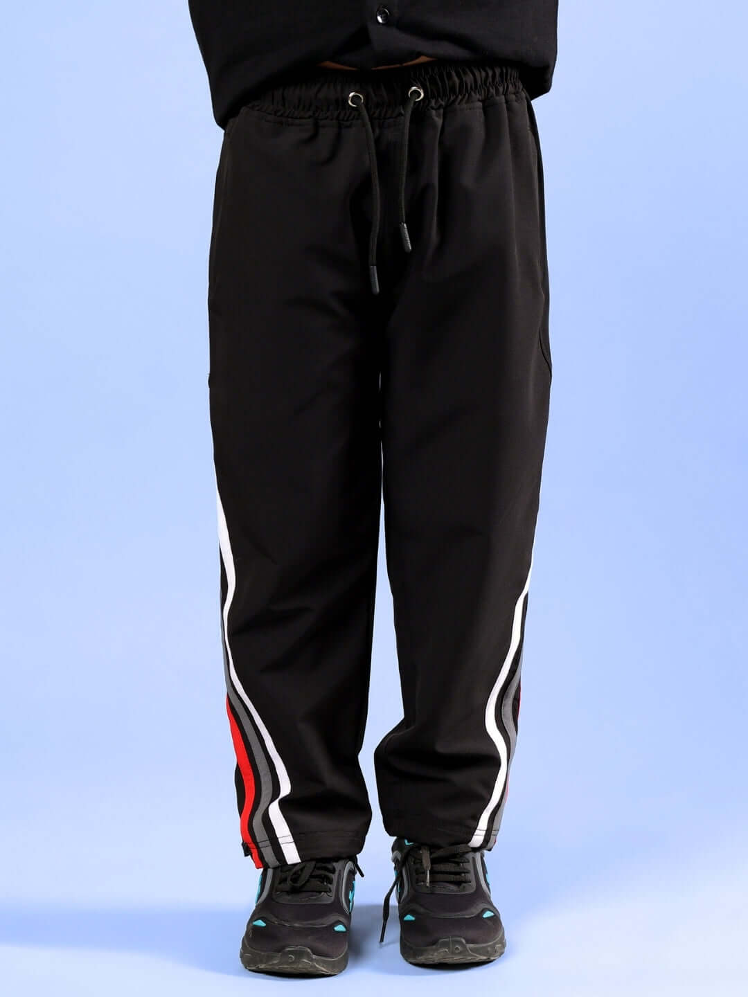 Black pants from FOREVER GAMER CO-ORD FOR BOYS & GIRLS BLACK with striped design.