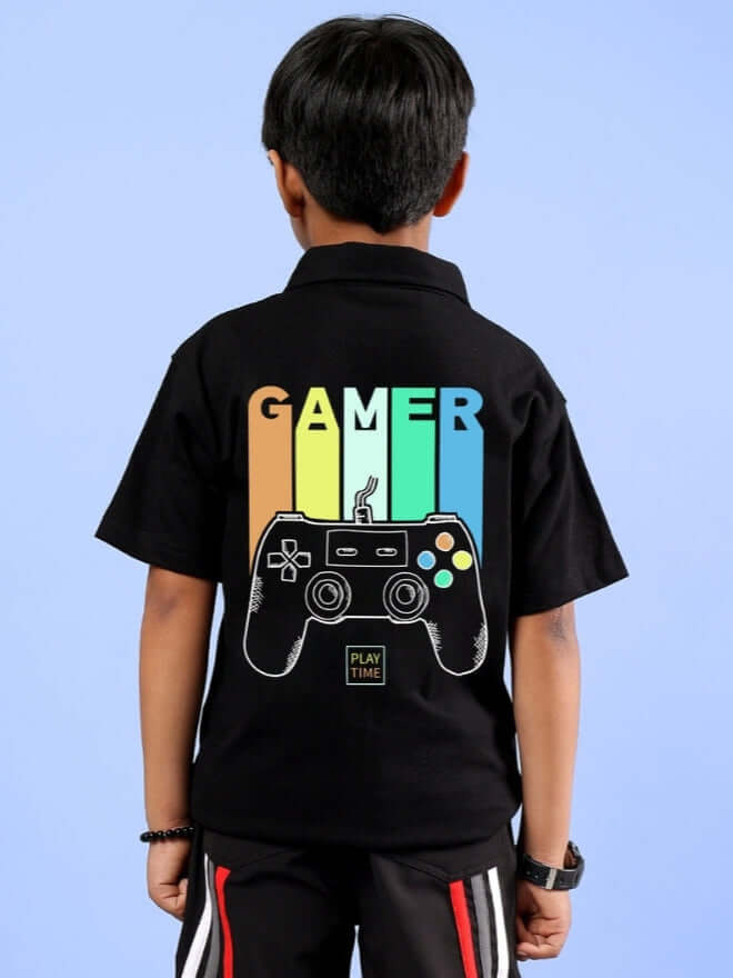 Child wearing a black FOREVER GAMER shirt featuring a colorful game controller design, suitable for both boys and girls.