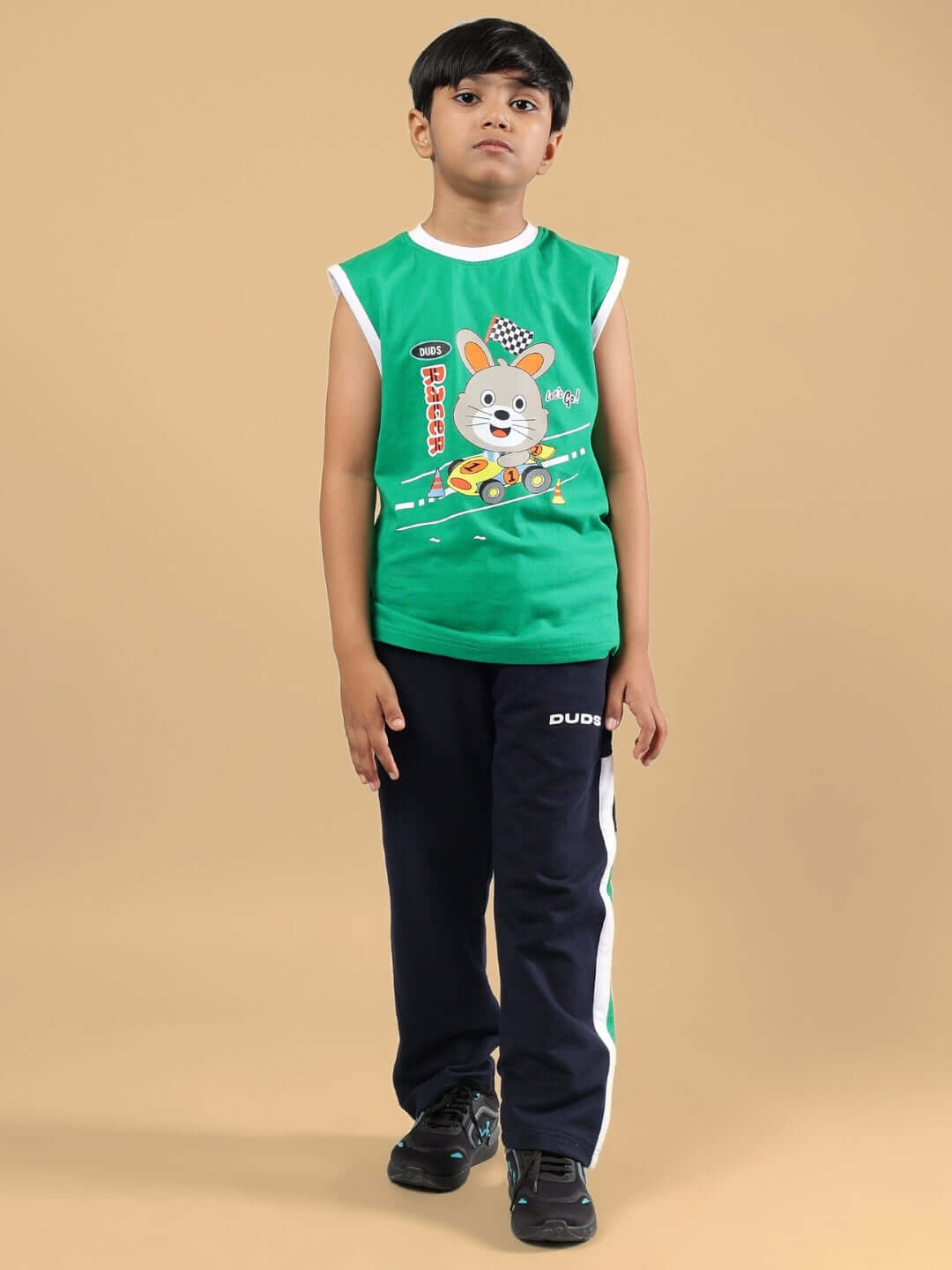 Child wearing FORZA CO-ORD FOR BOYS & GIRLS NAVY-GREEN, made by DUDS, featuring playful design. Custom fit available for prepaid orders.