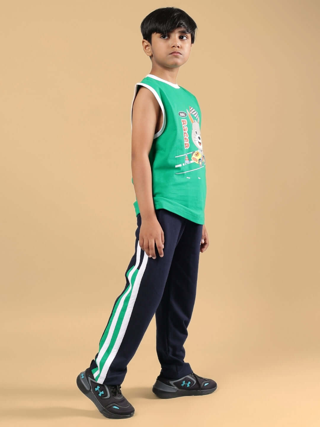 FORZA CO-ORD FOR BOYS & GIRLS NAVY-GREEN outfit displayed on a young model, featuring a stylish green and navy design with stripe details.