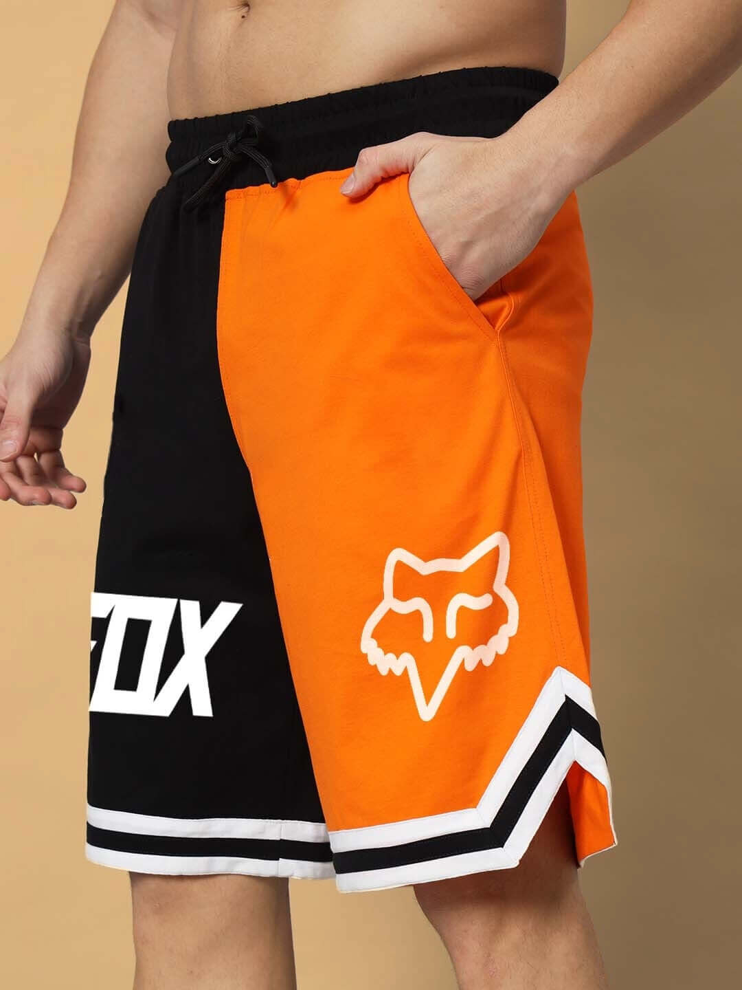 FOX regular fit shorts in orange-black color with customizable fit options, featuring side pockets and logo detailing.