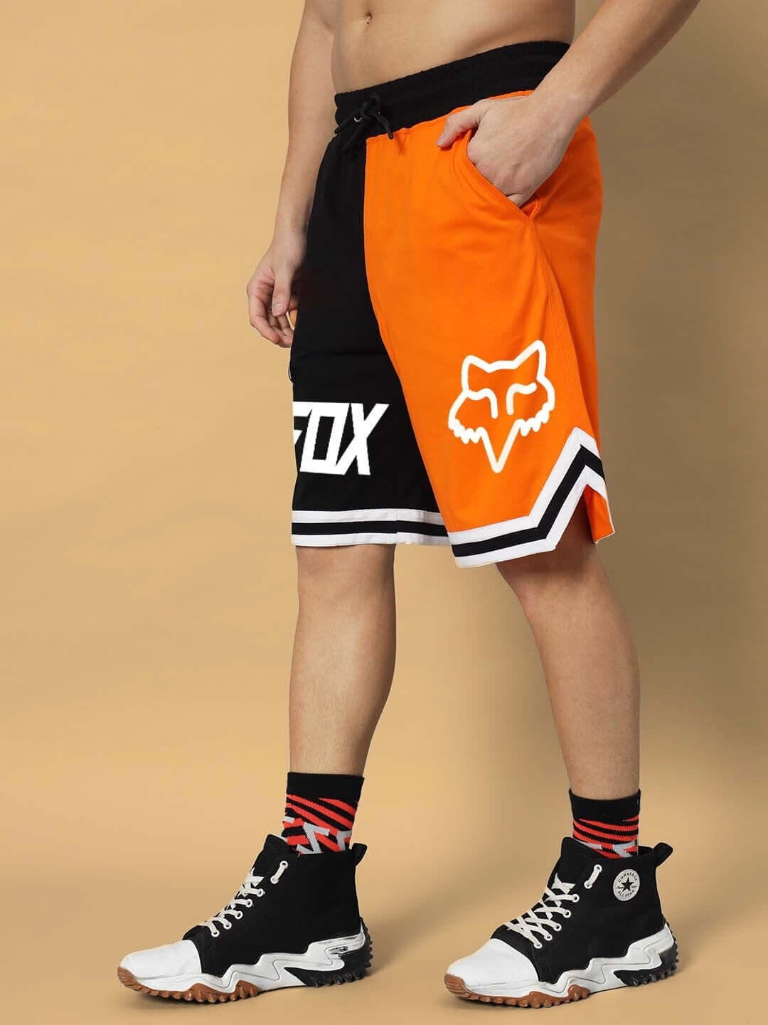 Model wearing FOX Regular Fit Orange-Black Shorts, featuring bold design and custom fit options for a personalized style experience.