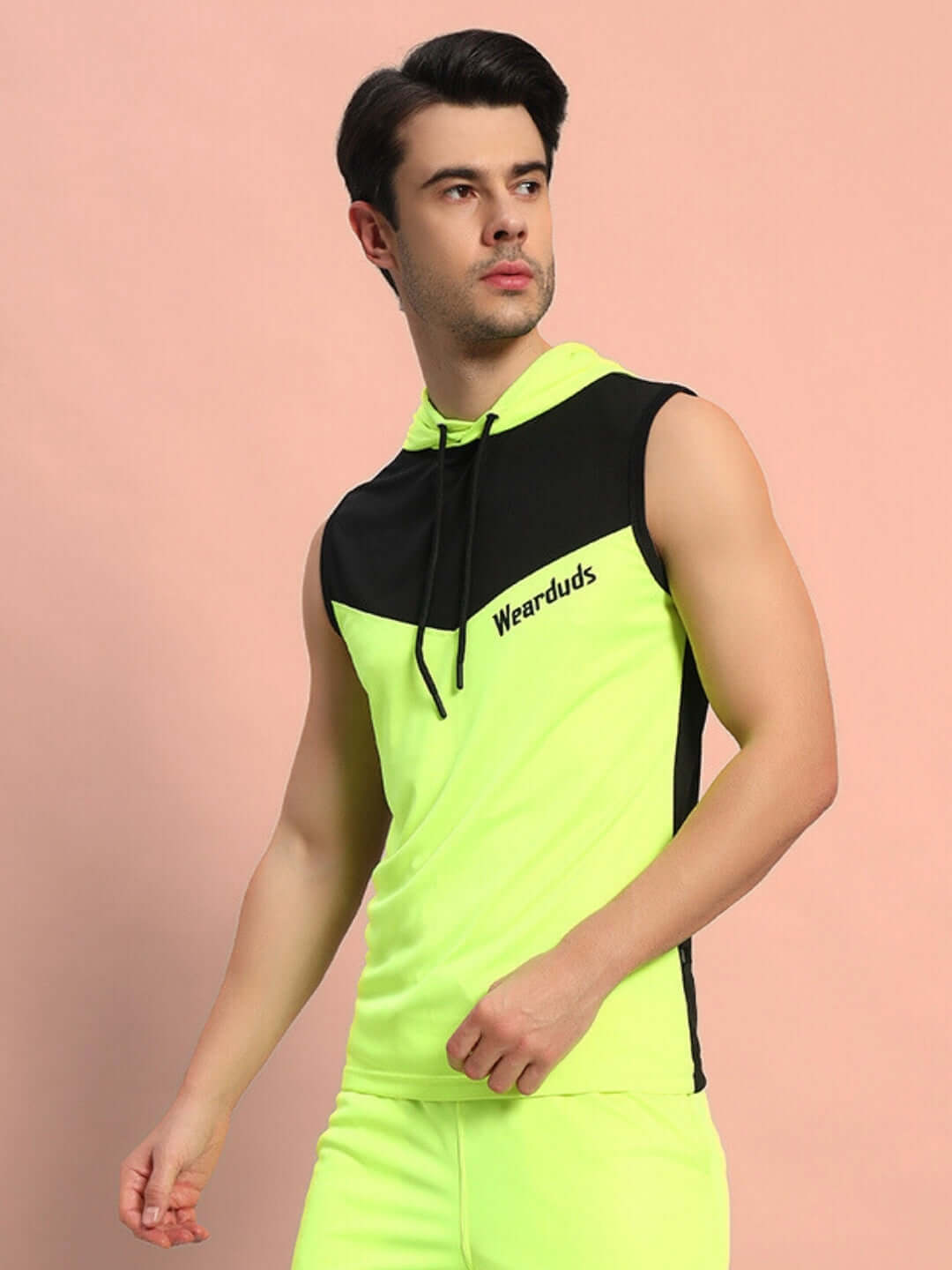 Model wearing FRANKY GYM T-SHIRT in neon green, showcasing fit and design for active lifestyle enthusiasts.