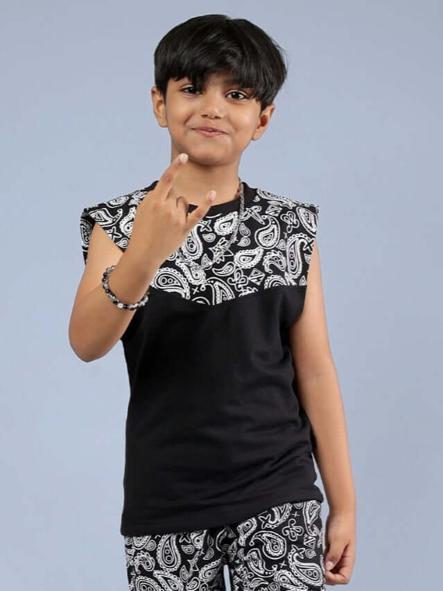 Boy wearing FREESTYLER OVERSIZED T-SHIRT FOR BOYS & GIRLS BLACK with paisley design, showing style and comfort.
