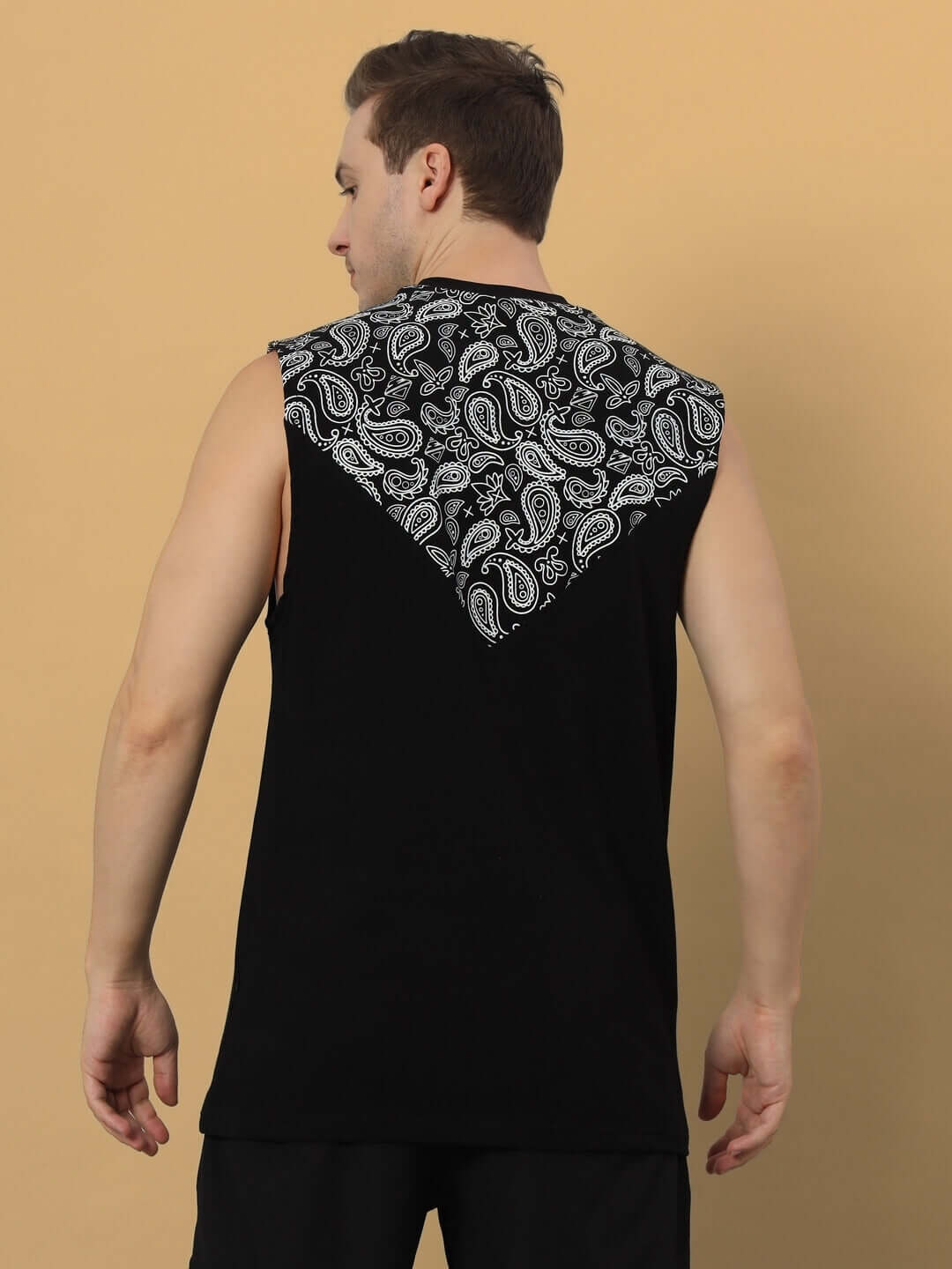 Back view of Freestyler sleeveless oversized T-shirt in black with paisley print. Premium cotton, comfortable fit. Ideal for casual wear.