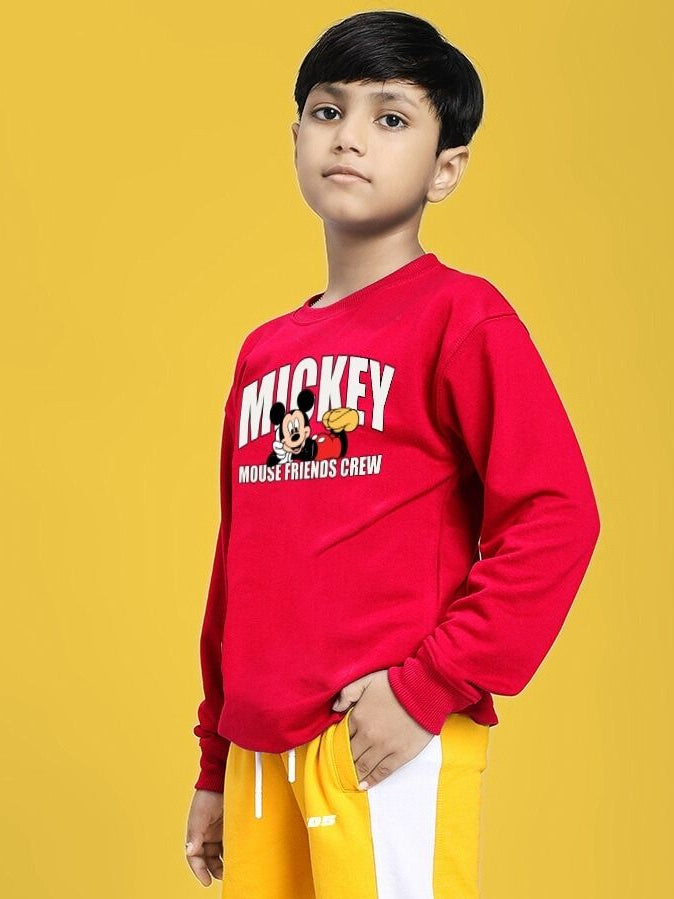 Young boy in red FRIENDS CREW PRINT SWEATSHIRT FOR BOYS GIRLS RED, stylish street-style outfit for kids.