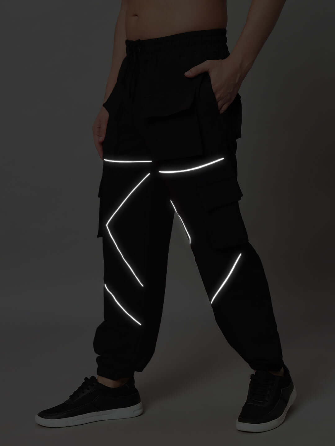 Black FRONTLINE REFLECTOR PARACHUTE CARGO PANTS with reflective detailing, customizable fit available for prepaid orders.