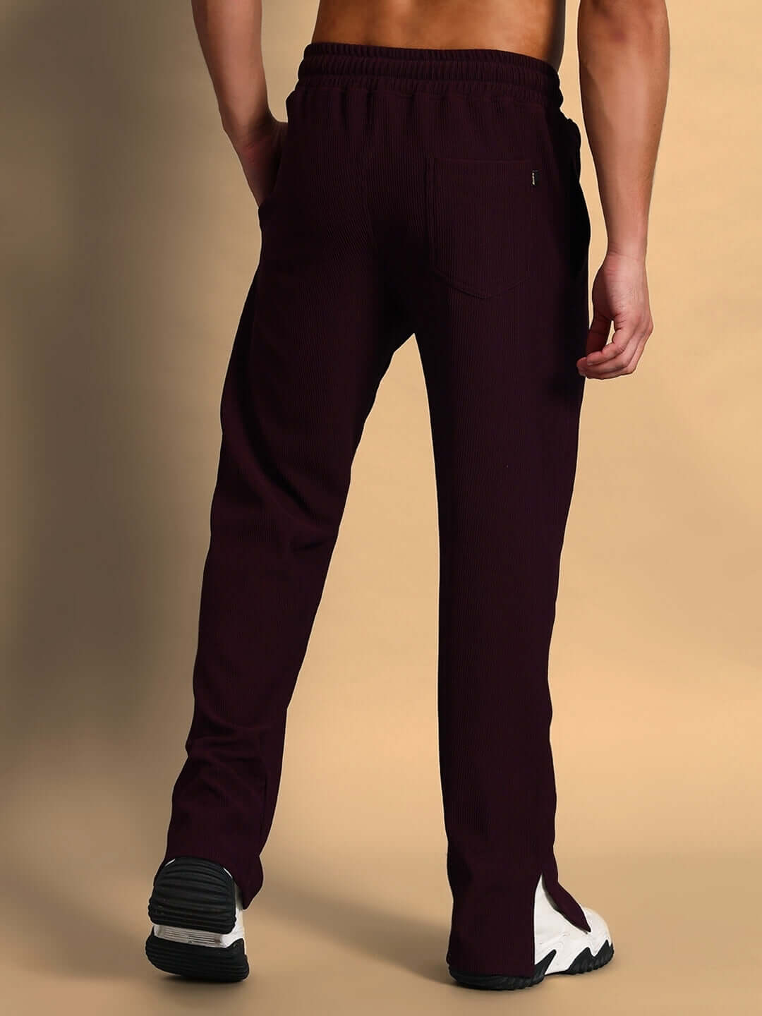 Back view of wine-colored Frowzy Side Slit Joggers showcasing custom fit options and slit design, available from DUDS.