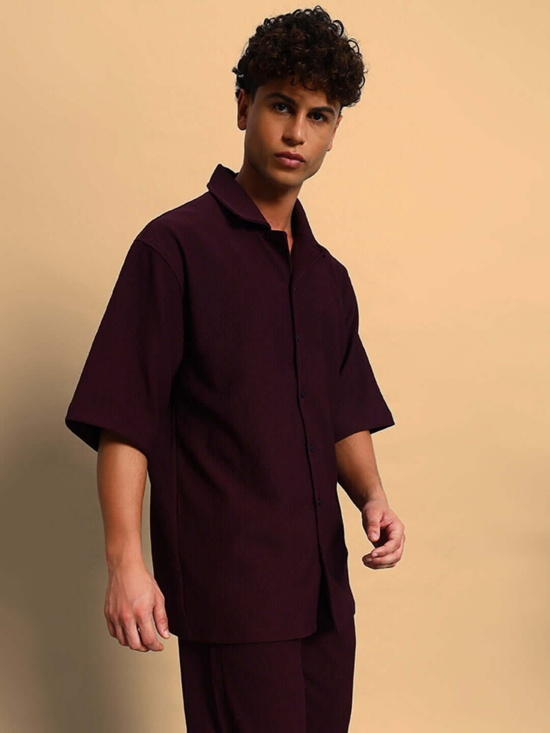 Model wearing Frowzy Solid Wine Shirt with half sleeves, 100% ribbed lycra, showcasing superior stretch and wrinkle-free design.