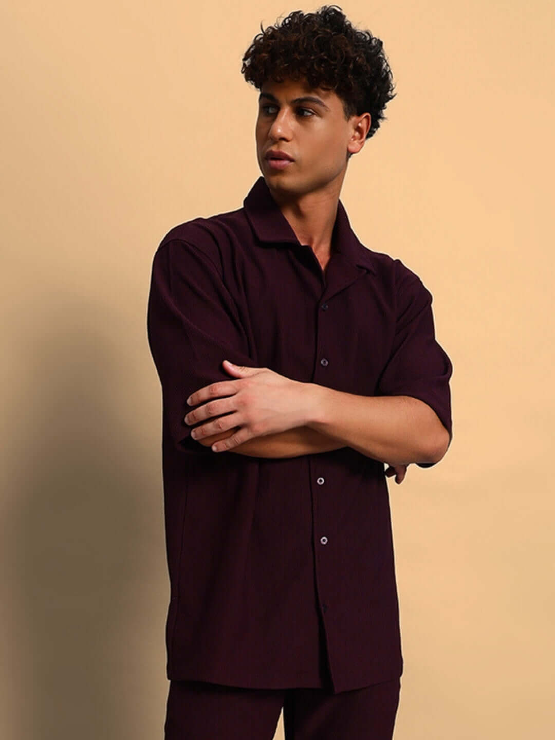 Model wearing FROWZY Solid Wine Shirt, half sleeves, ribbed Lycra, curved hem, ideal for all-day wear, featuring superior stretch and wrinkle-free fabric.