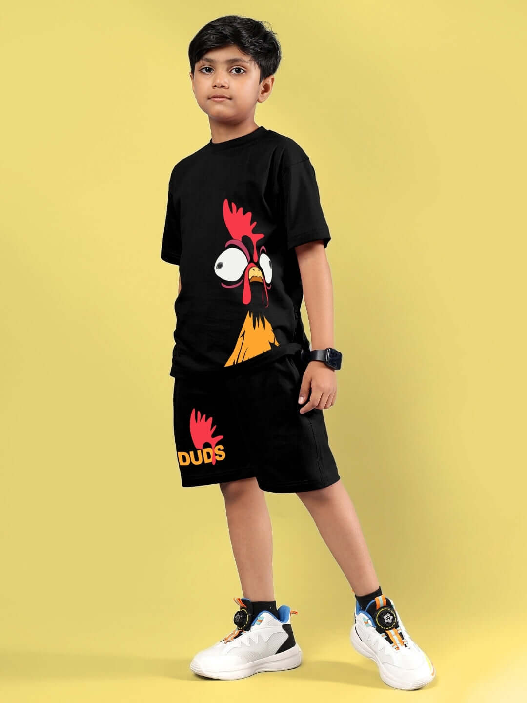 Child wearing FUNNY CHICKEN PRINTED CO-ORD FOR BOYS & GIRLS BLACK by DUDS, featuring a humorous chicken design on black fabric.