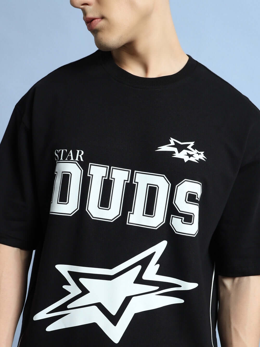 Galaxy oversized black T-shirt featuring DUDS star graphic, customizable size available for prepaid orders.