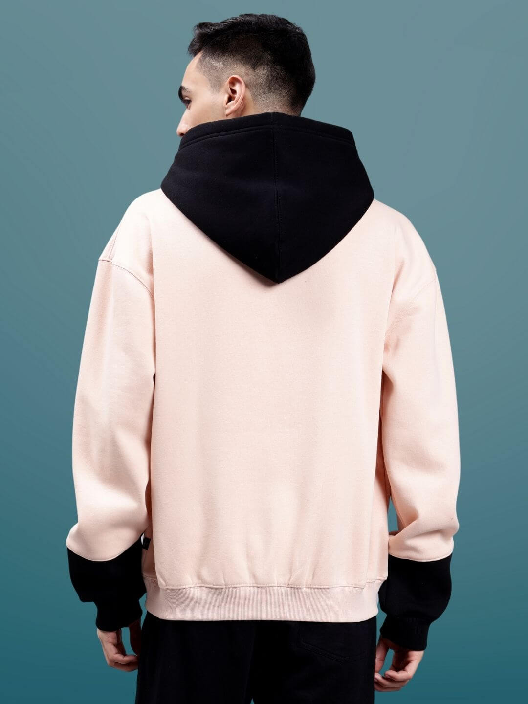 Back view of Generation Duds Fleece Colorblock Oversize Hoodie worn by a person, featuring a stylish colorblock design and oversized fit.