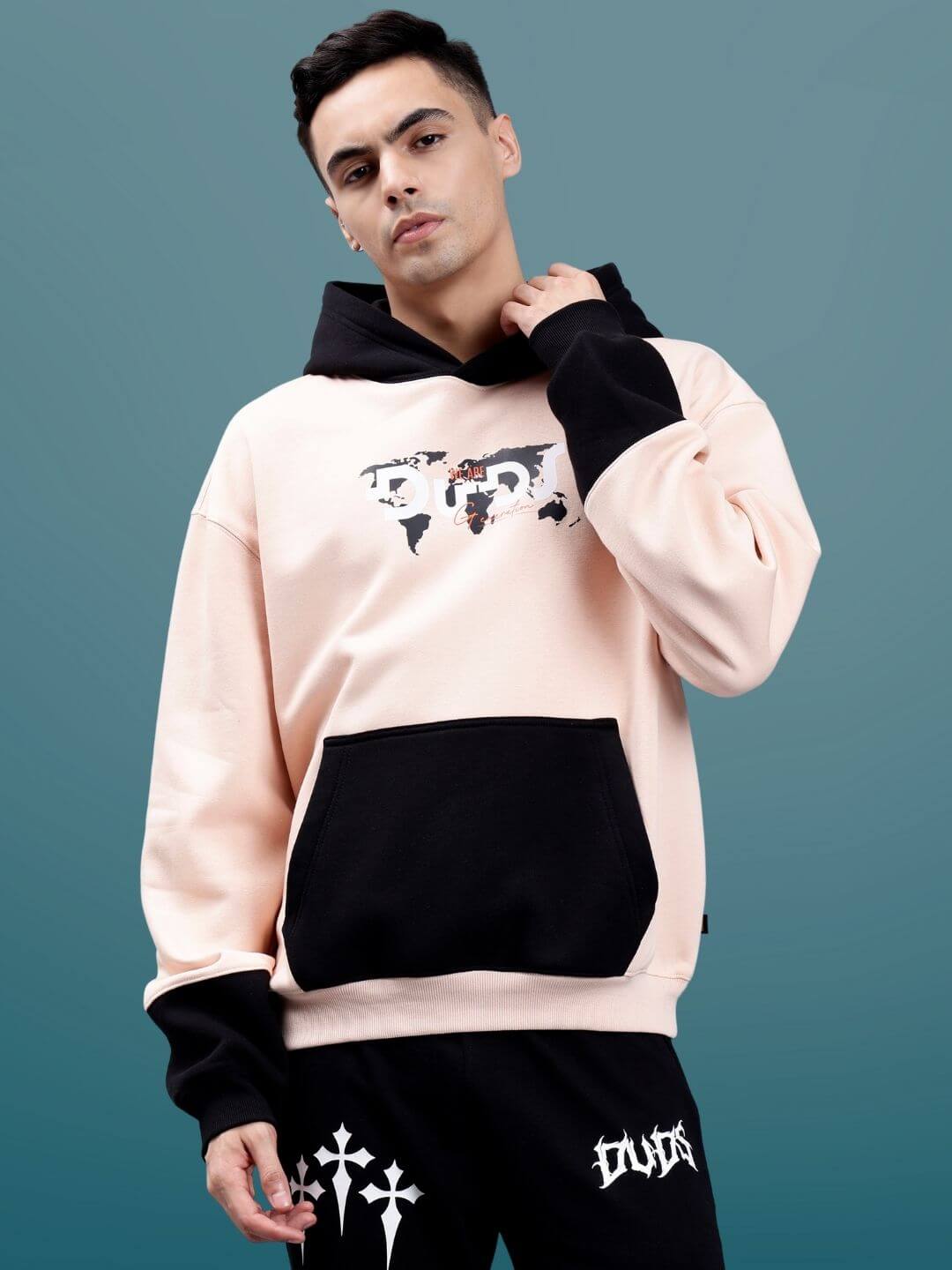 Model wearing Generation Duds Fleece Colorblock Oversize Hoodie, showcasing urban streetwear style.