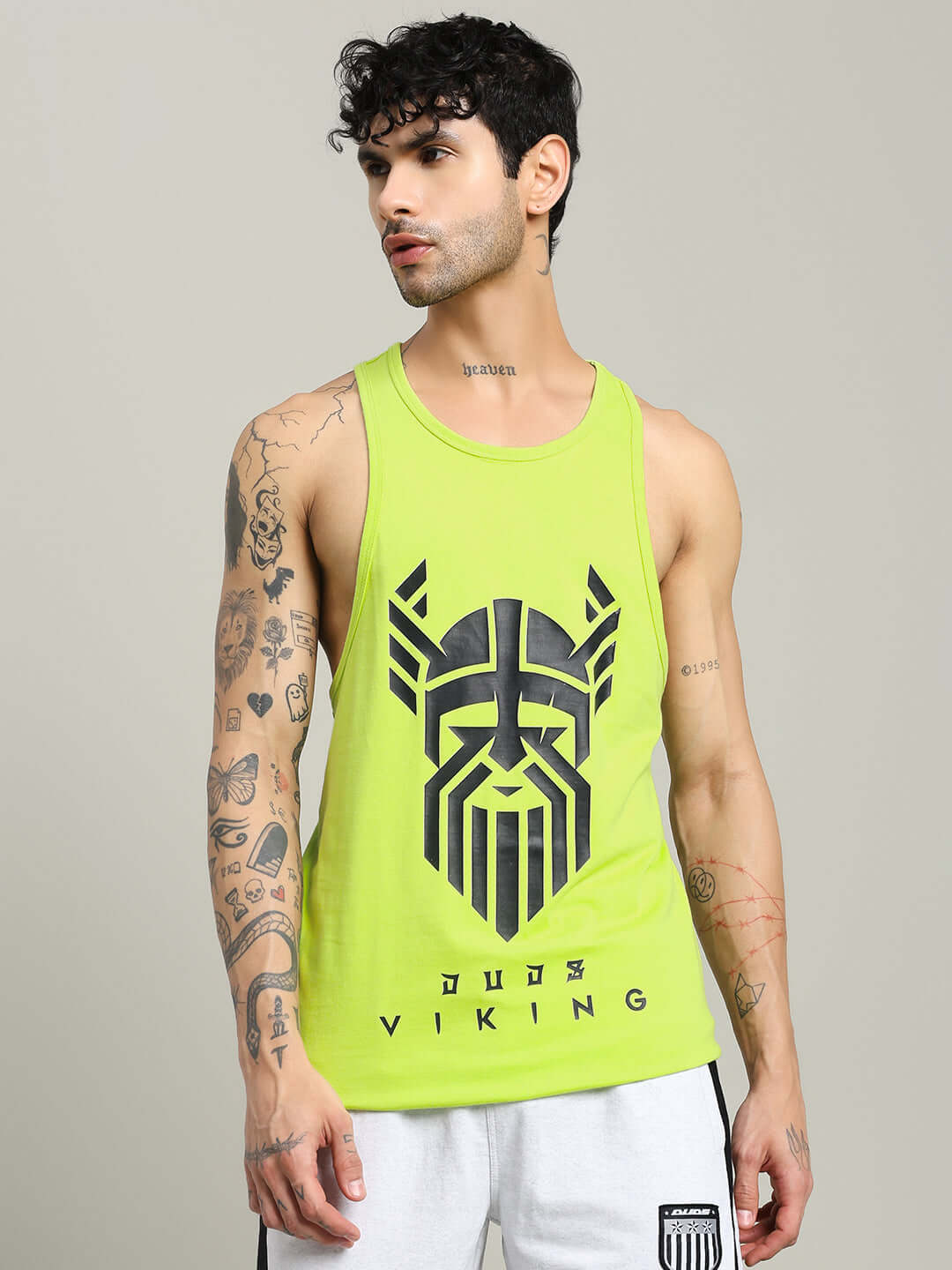 Man wearing Gladiator Gym Neon Green T-Shirt by DUDS, featuring Viking graphic, ideal for custom fit gym wear enthusiasts.