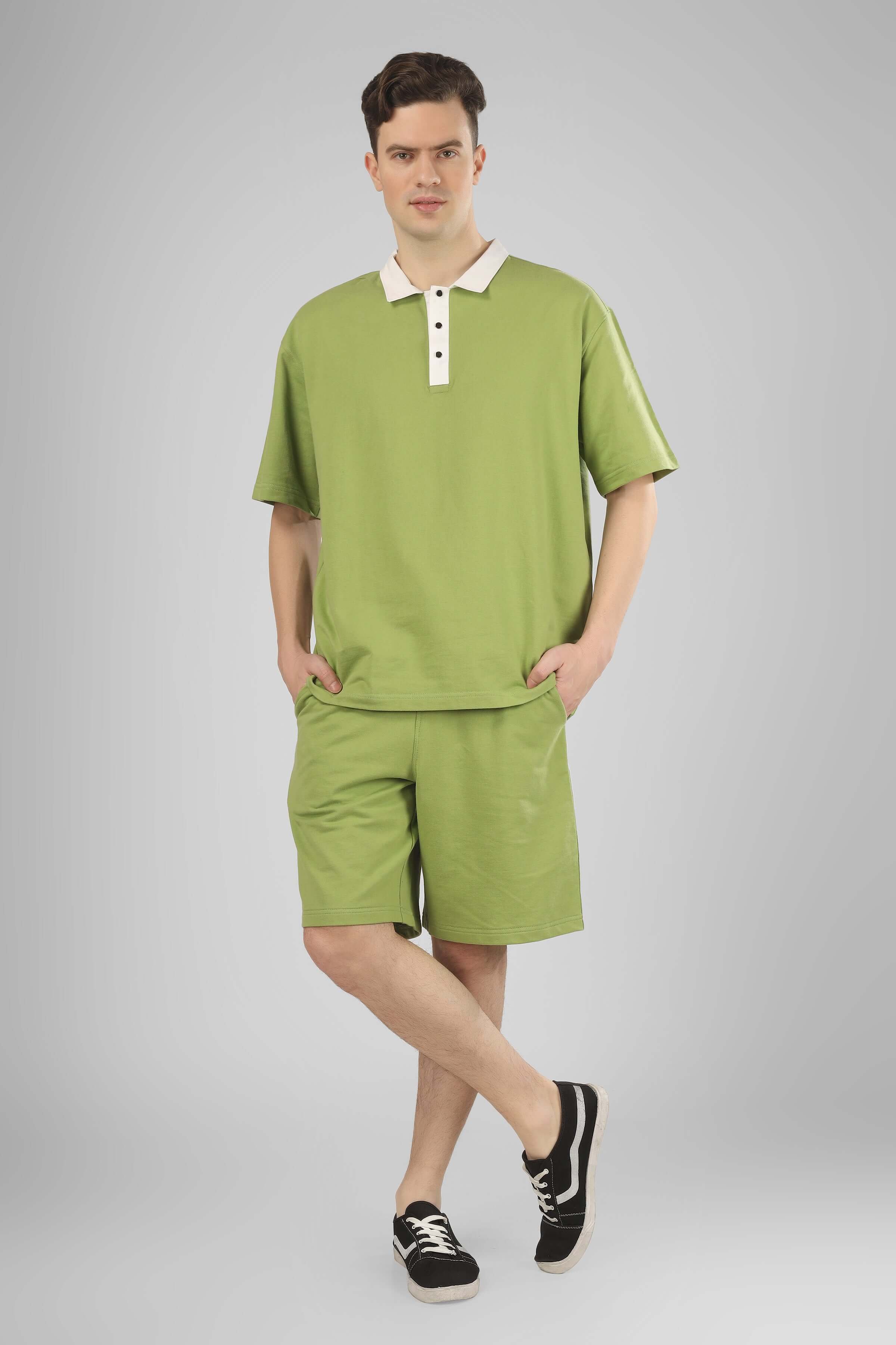 Model wearing Glazy Co-ord Set in pista green, premium cotton French terry lycra, short-sleeve shirt and shorts, casual style.
