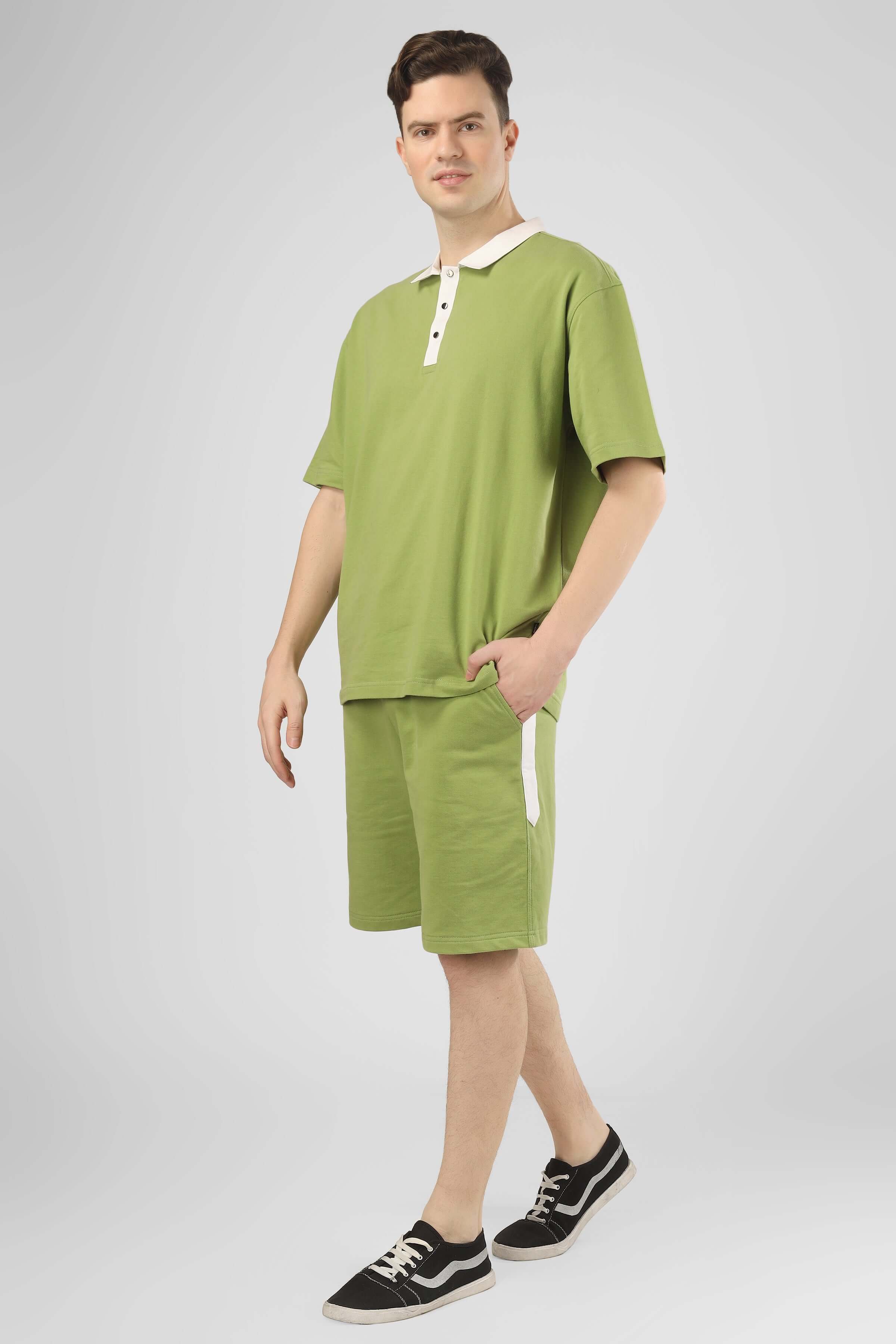 Man wearing GLAZY CO-ORD Set in pista green with premium cotton French terry lycra fabric, perfect for casual wear.