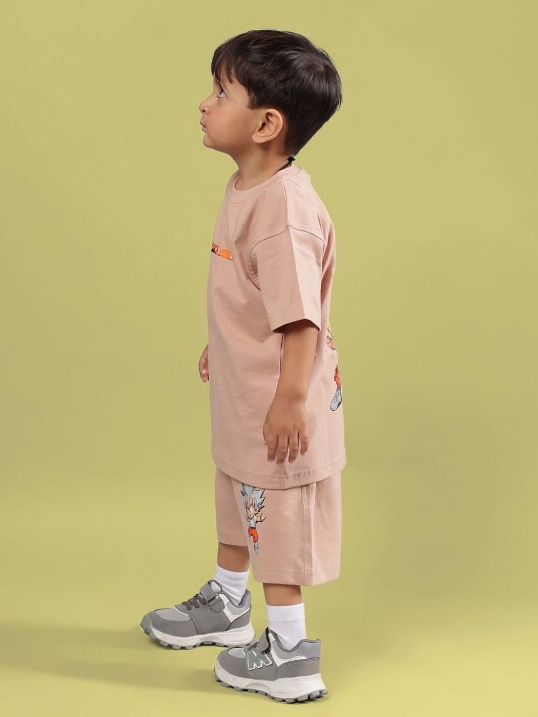 Child wearing GOHAN SUMMER CO-ORD FOR BOYS & GIRLS BEIGE showing side view