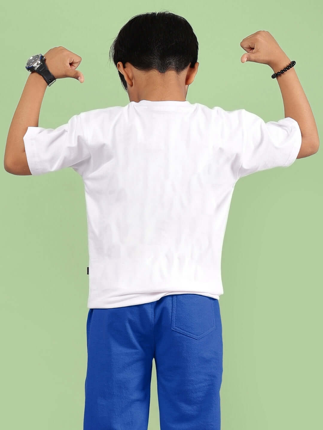 GOKU WARRIOR T-SHIRT FOR BOYS & GIRLS WHITE, back view, model flexing arms, made to order by DUDS, customizable size option available