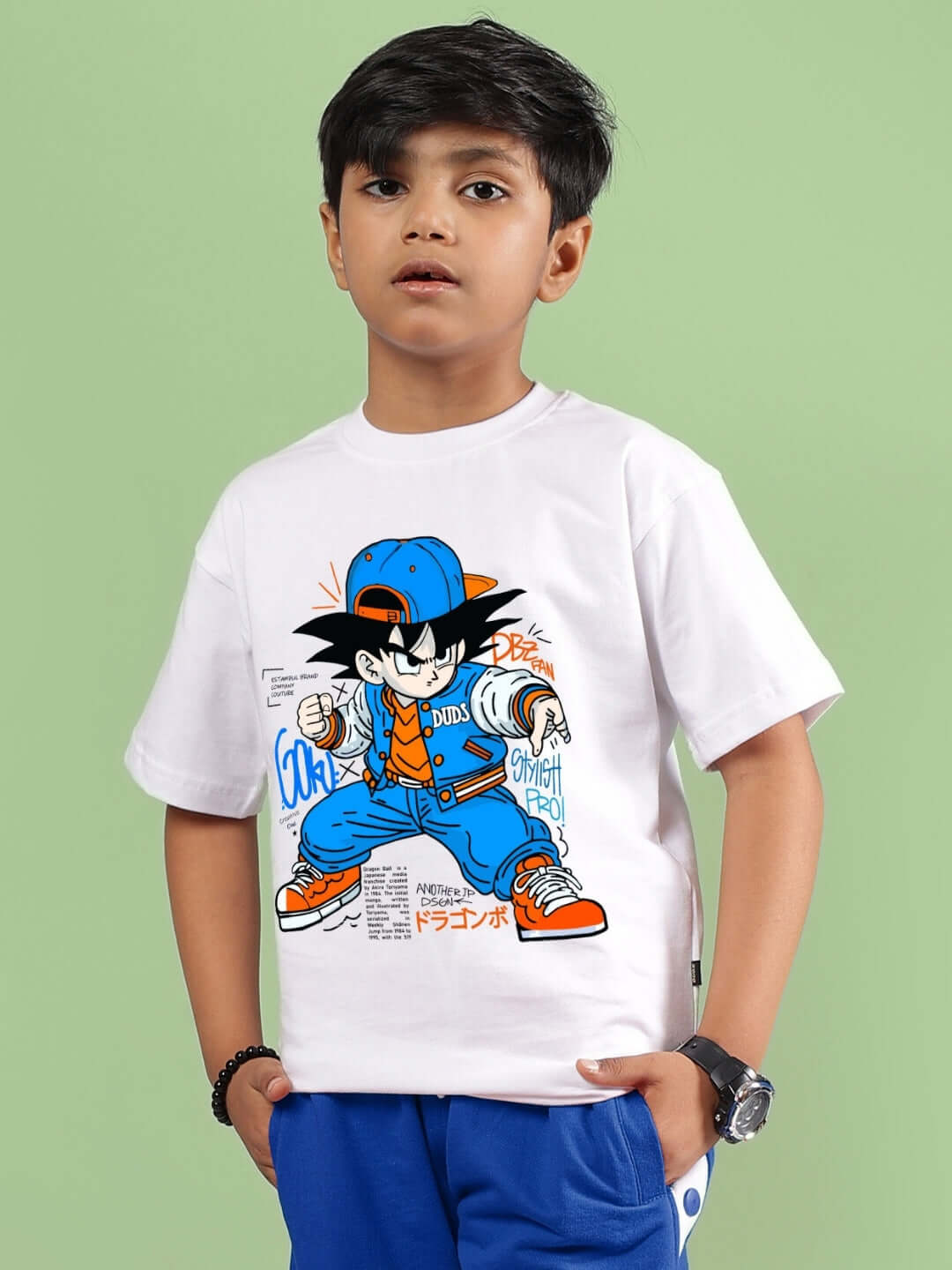 Child wearing a white Goku Warrior T-shirt for boys and girls, featuring a colorful anime design by DUDS.