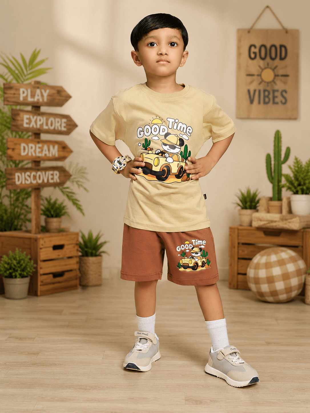 GOOD TIME PRINT CO-ORD FOR BOYS GIRLS BEIGE BROWN featuring a boy in a playful outfit with cartoon graphics.