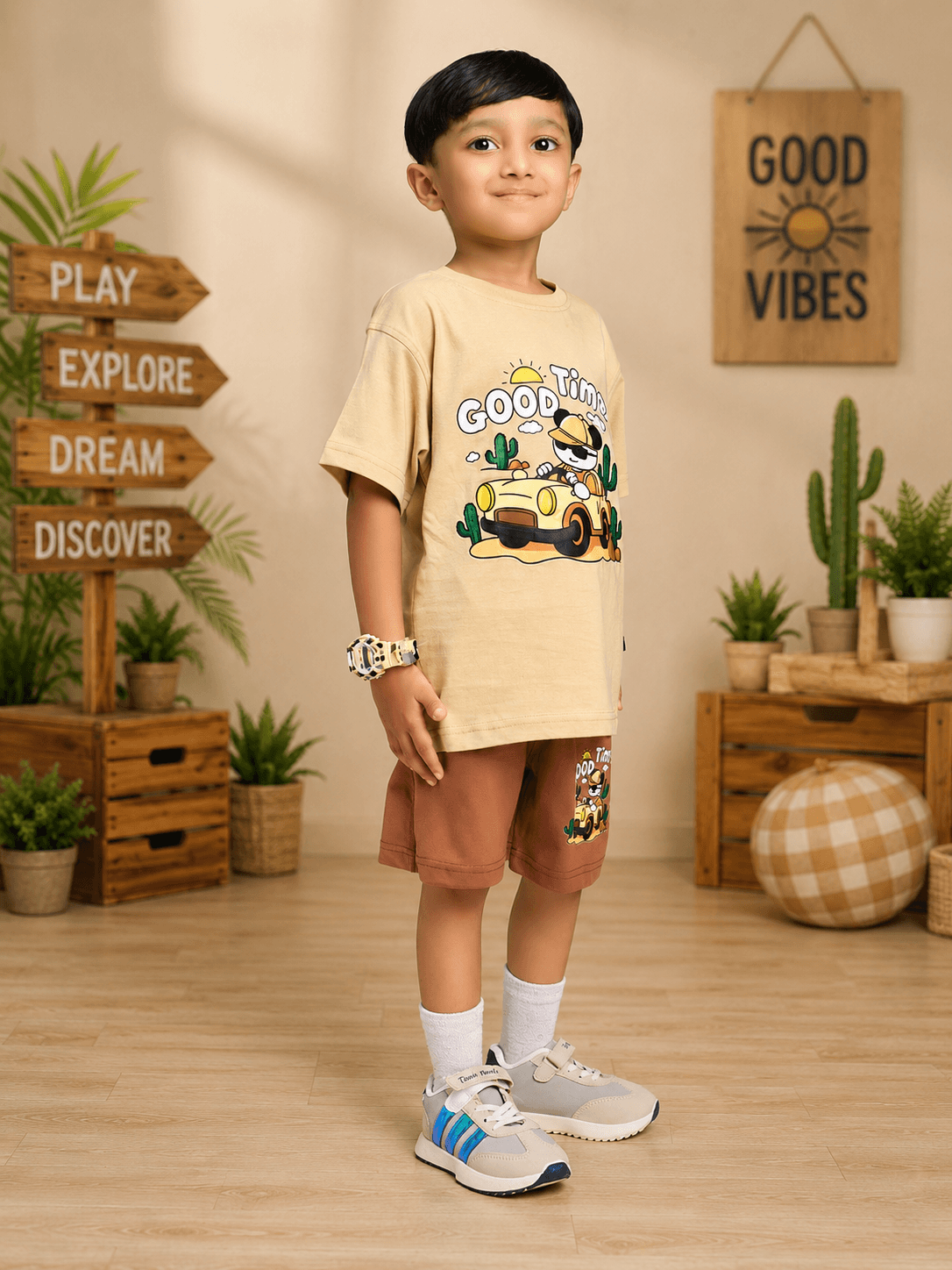 GOOD TIME PRINT CO-ORD FOR BOYS GIRLS BEIGE BROWN featuring a smiling boy in a cartoon bear graphic outfit.