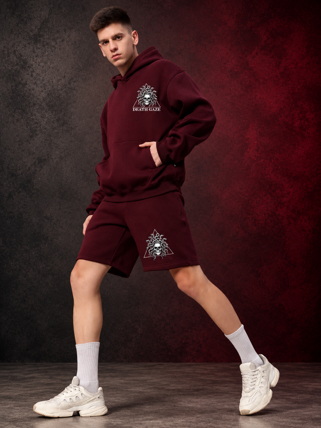 GORGON SKULL PRINTED FLEECE CO-ORD SET WINE worn by model in hoodie and shorts streetwear style