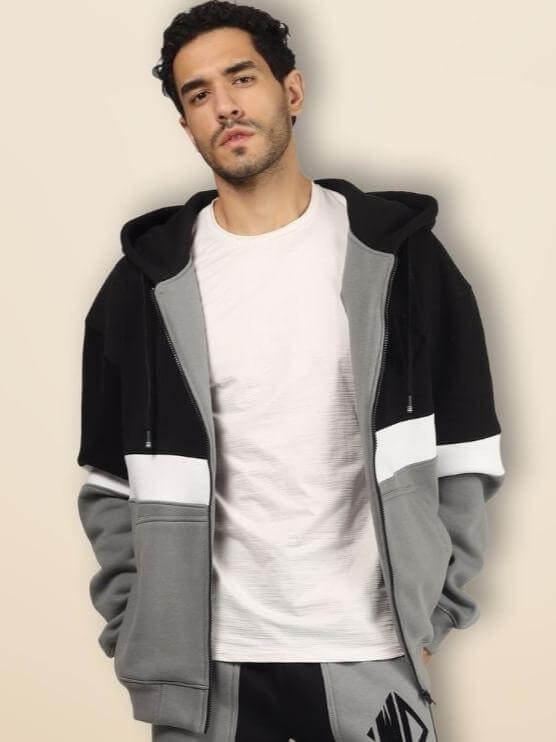 Man wearing GORBCORE FLEECE COLORBLOCK ZIPPER HOODIE with full-zip closure and colorblock design for modern streetwear style.