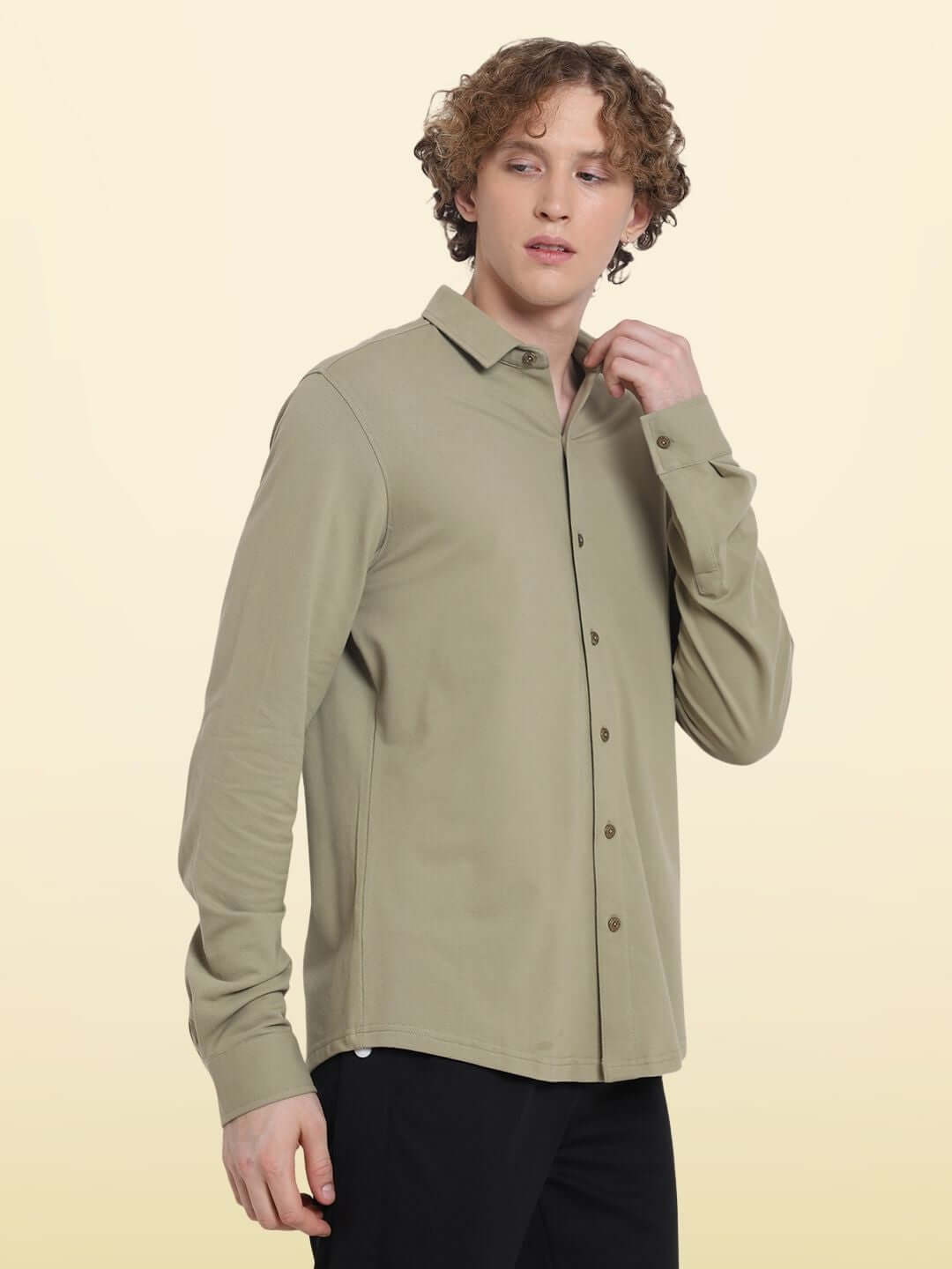 Model wearing GRAVEL SPORTY PIQUE SHIRT, full sleeve, 4-way stretch, wrinkle-free, slim fit, 100% cotton Lycra, olive green color.